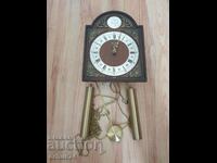Clock with weights.