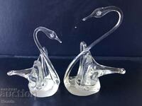 Glass figurines of swans
