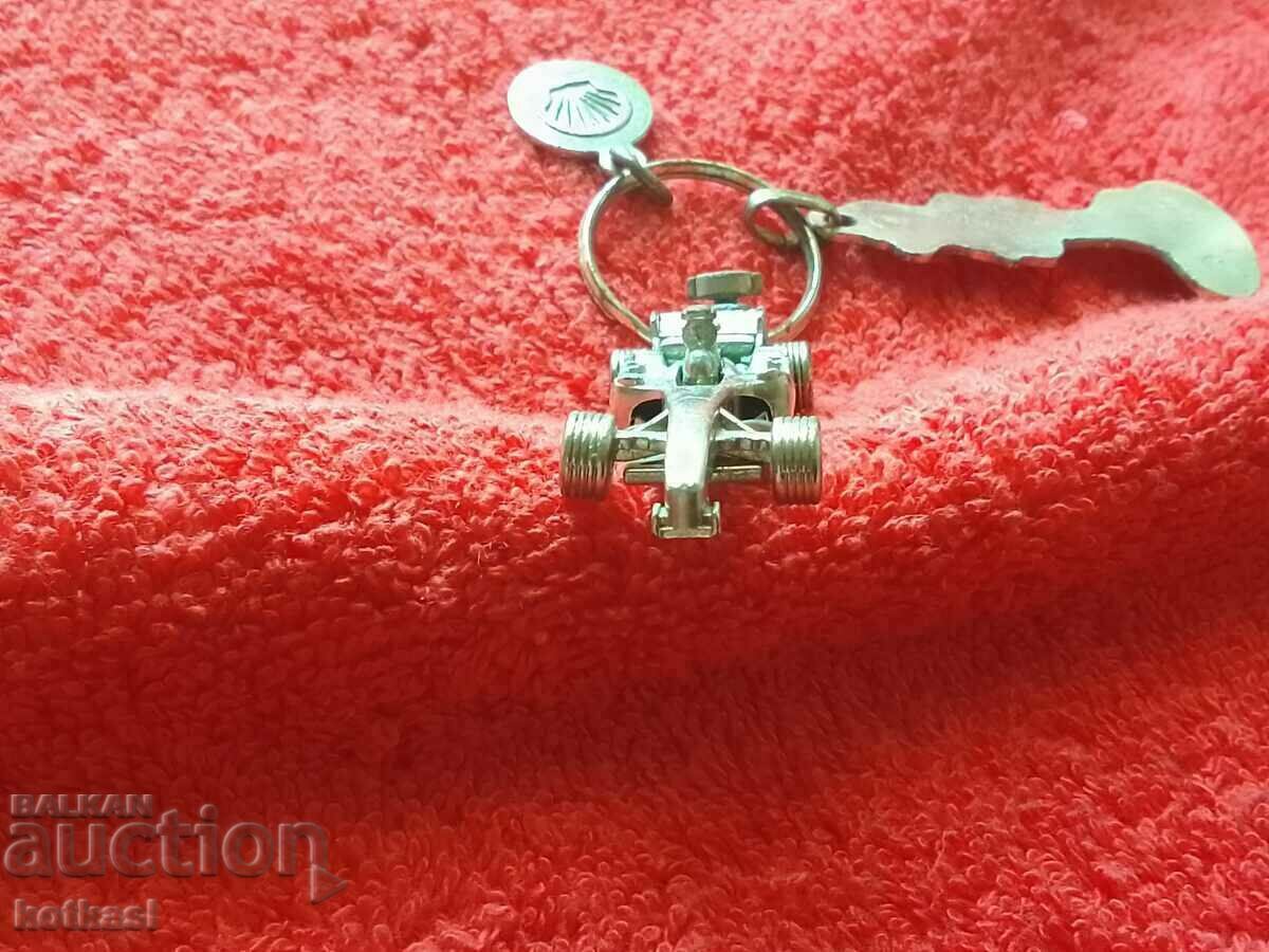 Delivery of Vintage Ferrari Shell Metal Keychain Delivery of Vintage Ferrari Shell Metal Keychain