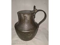 Old copper pot jug with lid