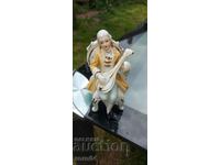 PORCELAIN STATUETTE