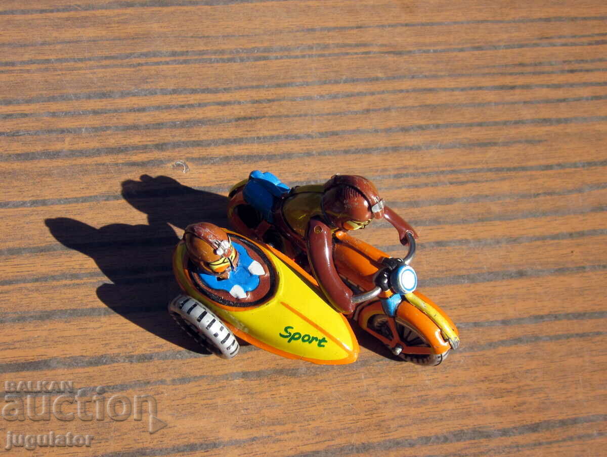 Delivery of old German metal sheet metal toy motor bikers