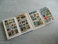 Nr.*7503 vechi album / folder cu 55 de timbre poștale