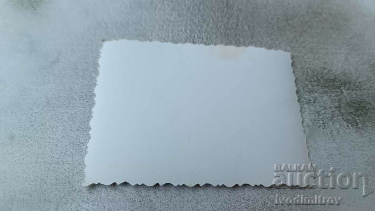 Photo Young girl in a swimsuit sitting on a sand dune with price 1.75 BGN | € 0.89