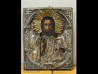Old icon of Jesus Christ painted with silver-plated fittings