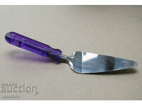 Metal cake spatula with plastic handle, preserved