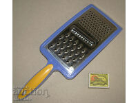 Manual kitchen grater 34 cm with three types of holes, preserved
