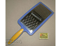 Manual kitchen grater 34 cm with three types of holes, preserved