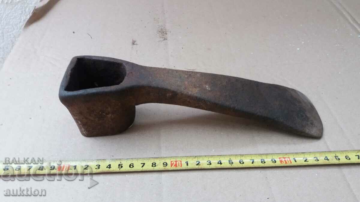a massive forged tool, a stone digger