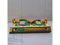 Old mechanical tinplate toy with winding train