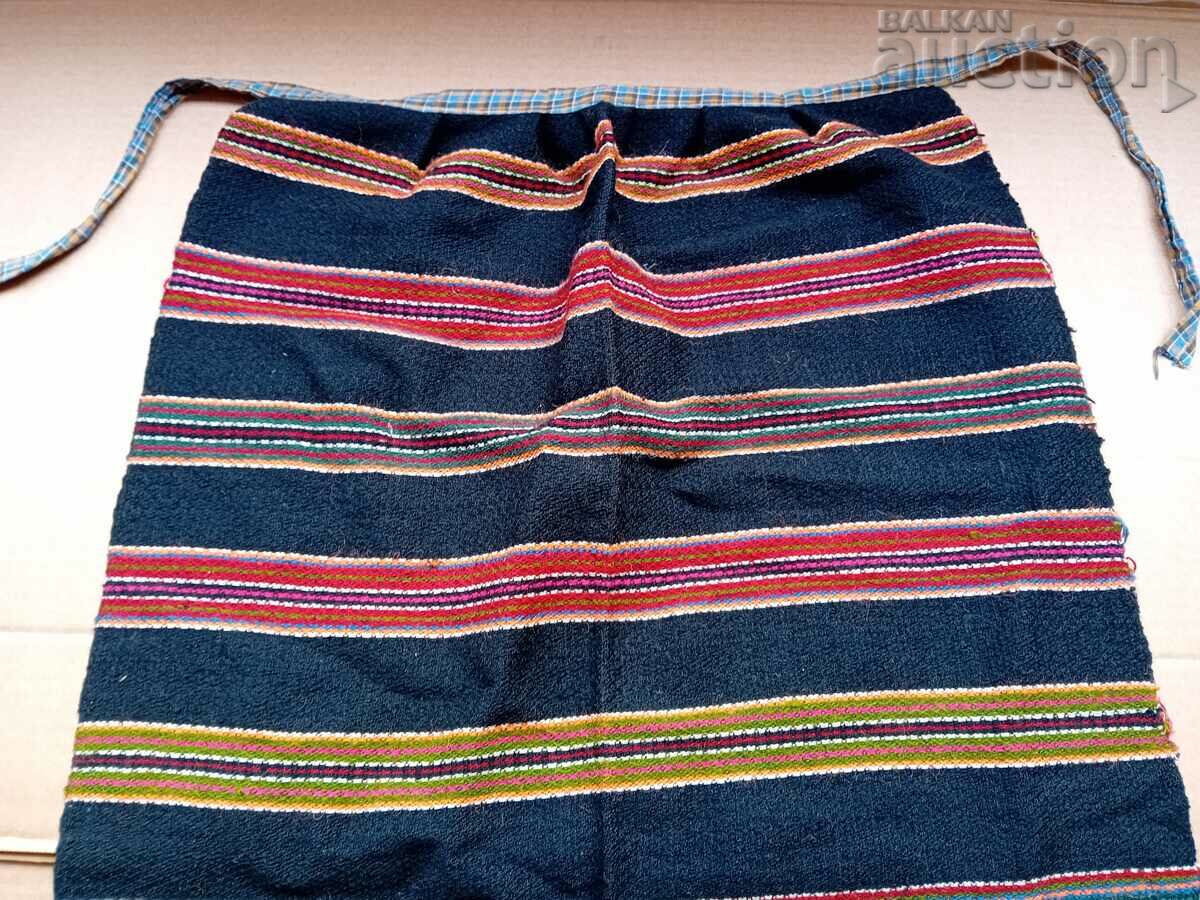 handwoven wool apron on a loom