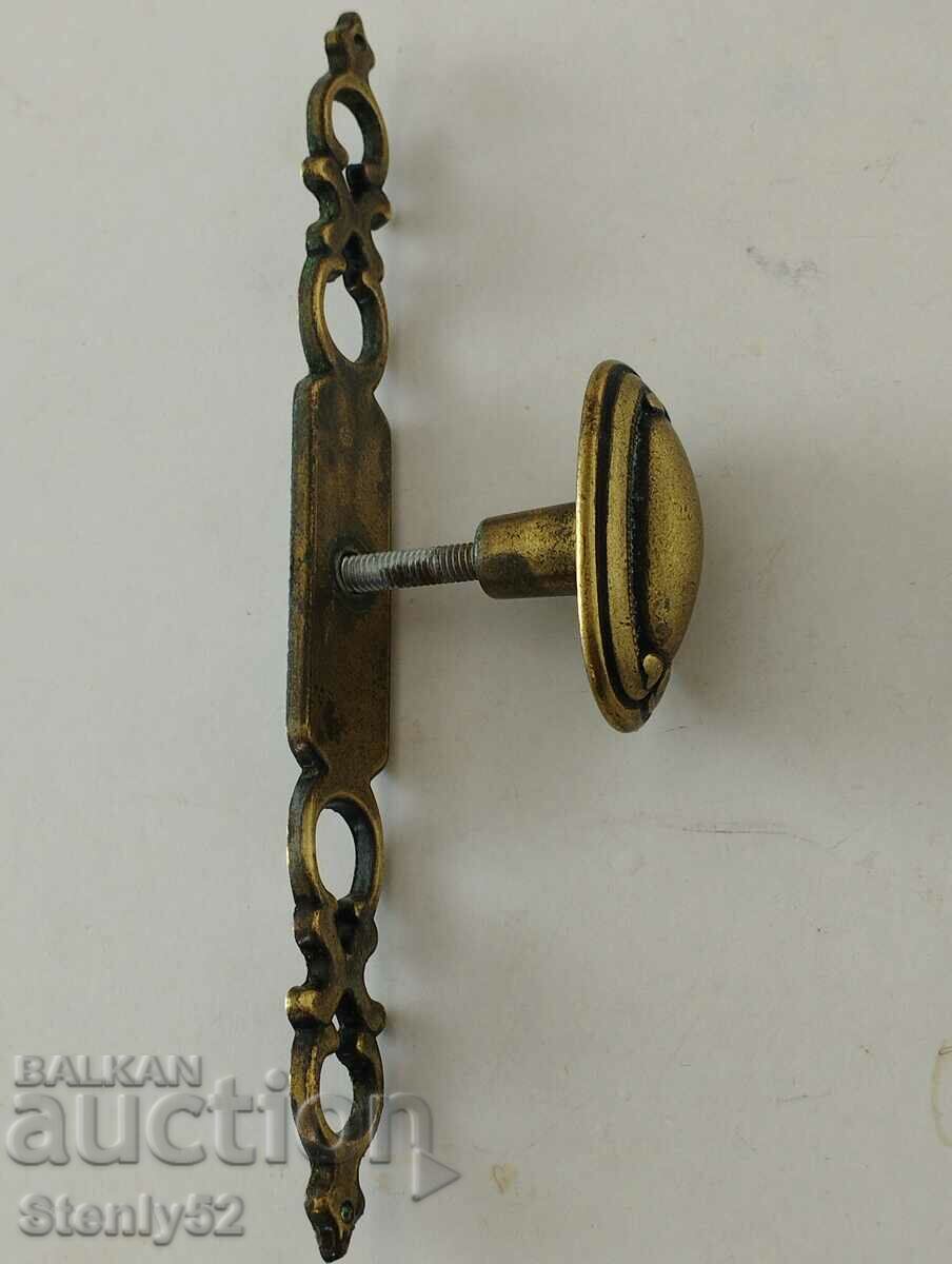 Old brass cabinet handle.