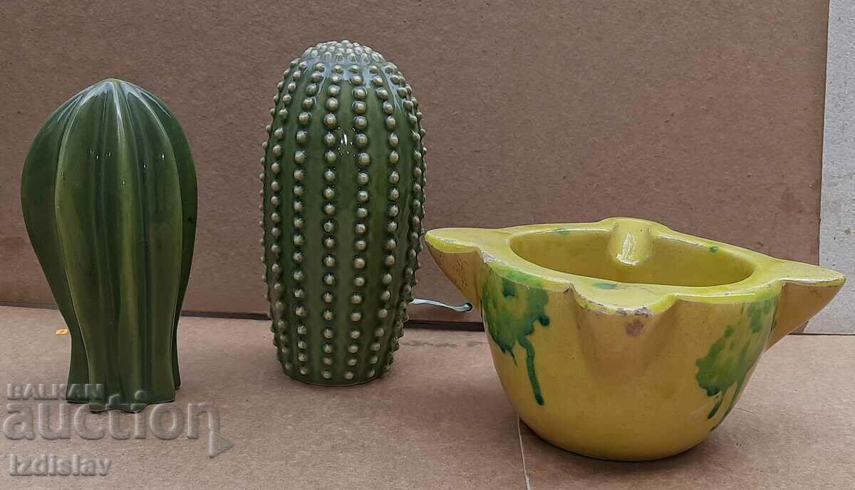 Two porcelain cactus figures and a ceramic ashtray
