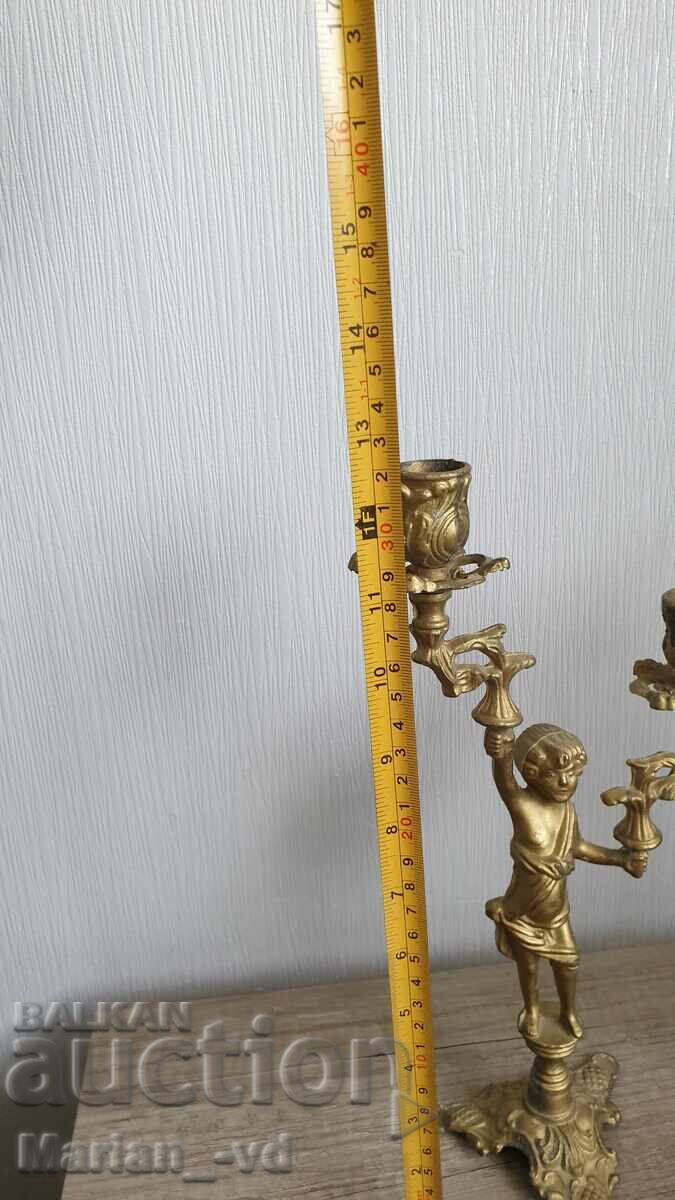 A pair of antique bronze candlesticks with price 150.00 BGN | € 76.69 A pair of antique bronze candlesticks with price 150.00 BGN | € 76.69