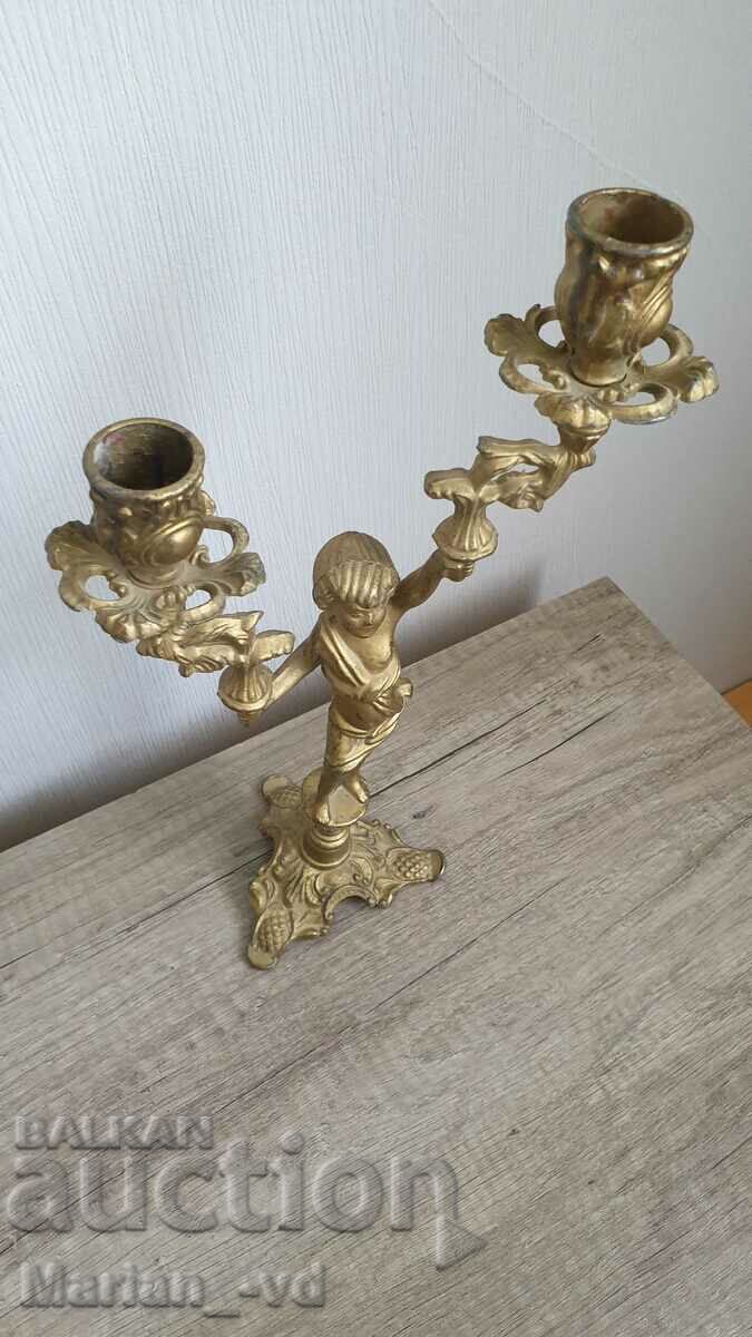 Auction A pair of antique bronze candlesticks Auction A pair of antique bronze candlesticks