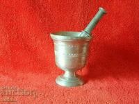 Old mortar made of white metal bronze aluminum mortar