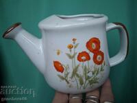 Beautiful porcelain watering can for decoration