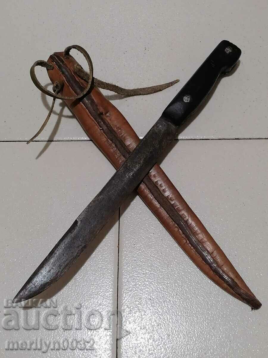 Old forged knife with leather sheath