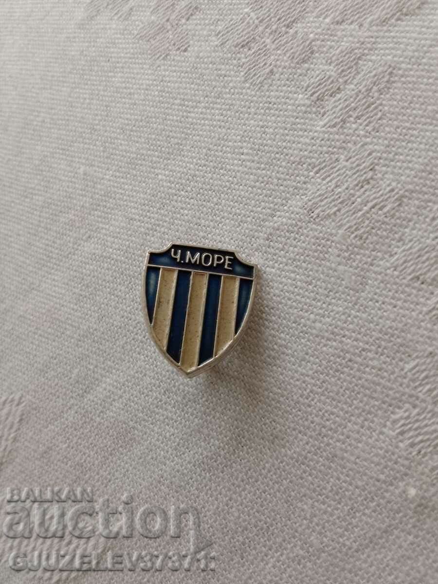 The h.more football badge