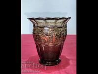 A beautiful glass vase with gilded relief decorations