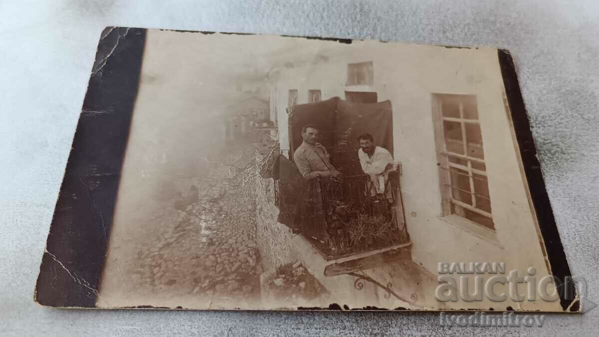 Photo Two officers on the balcony of a room on the PSV front
