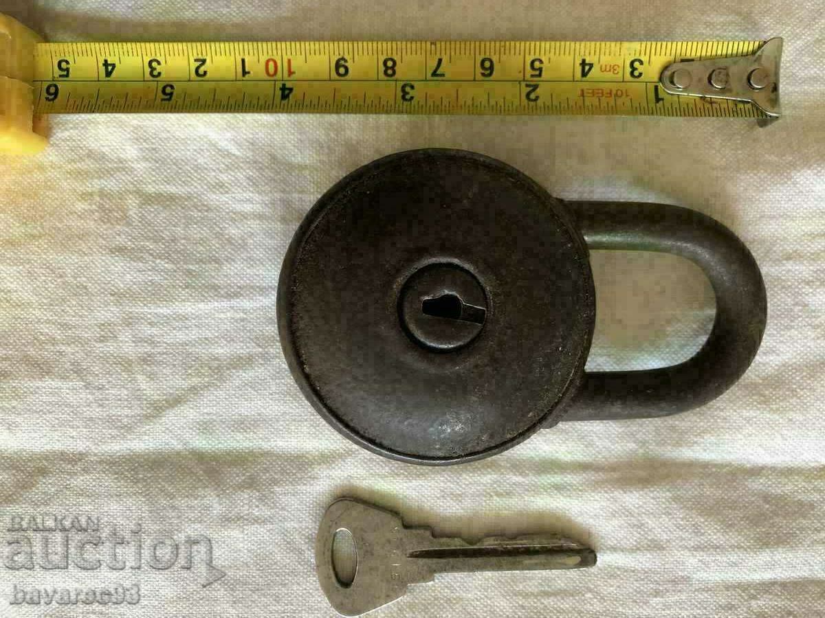 Old padlock with key working.