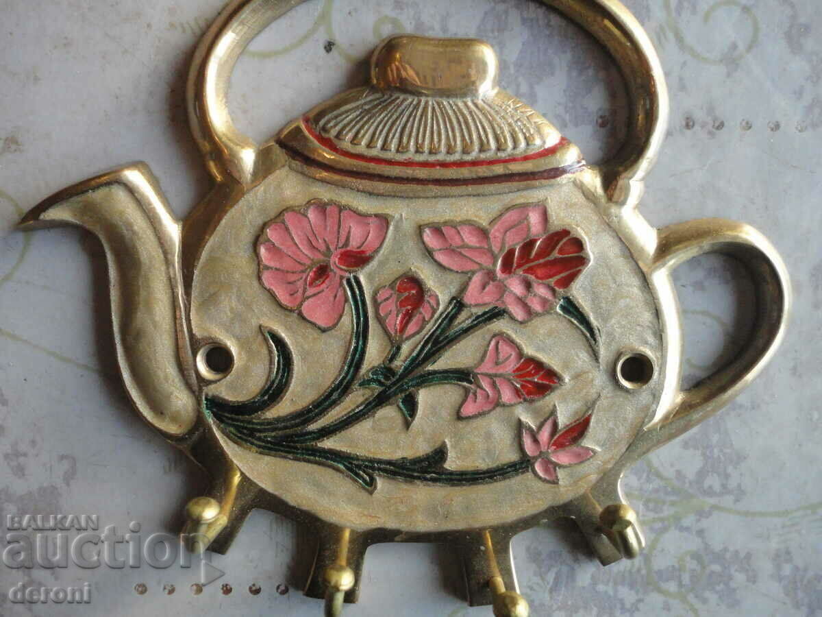 Delivery of Unique bronze key holder with enamel