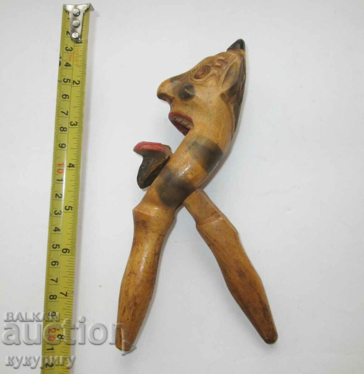 Delivery of Old ethnic folklore - wooden nutcracker devil figure