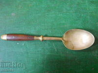 Old bronze serving spoon