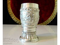 Pewter cup with legendary paintings.