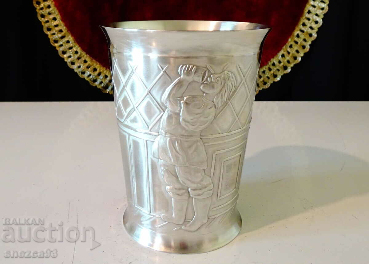 A pewter cup with a Young Man and an Innkeeper.
