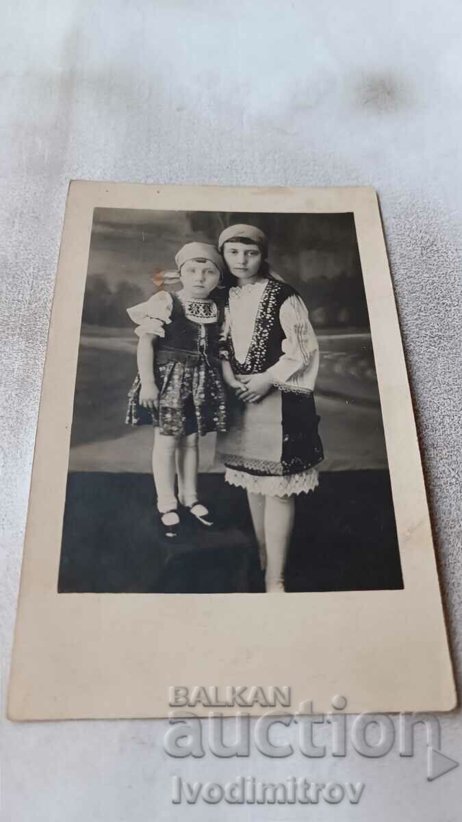 Photo Two girls in folk costumes