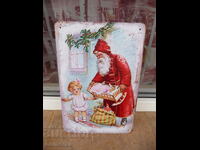Metal plate miscellaneous Santa Claus gives gifts to children Mraz