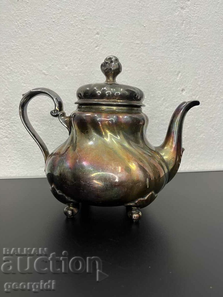 Porcelain teapot covered with silver foil. #5458