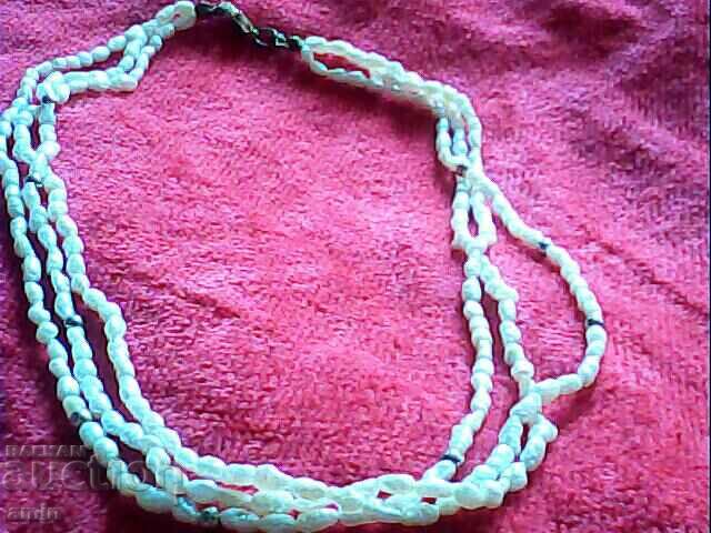 old beautiful necklace of 3 rows of pearls