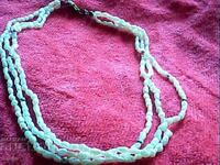 old beautiful necklace of 3 rows of pearls