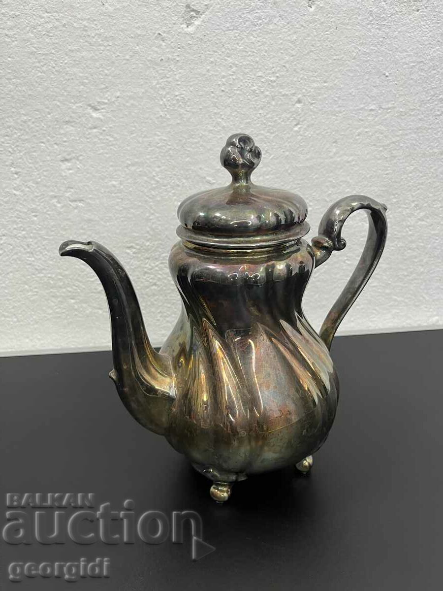 Porcelain teapot covered with silver foil. #5465