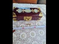 Old wooden jewelry box with padlock