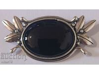 Silver brooch with onyx