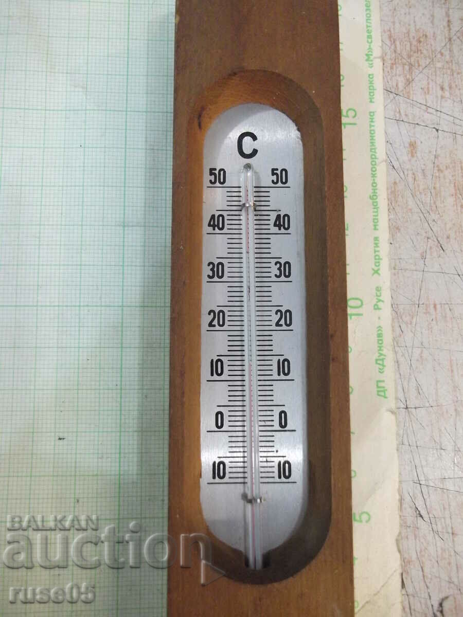 Auction Thermometer in a wooden frame Auction Thermometer in a wooden frame
