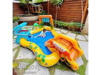 Complete summer fun: Splashing inflatable pool with slide