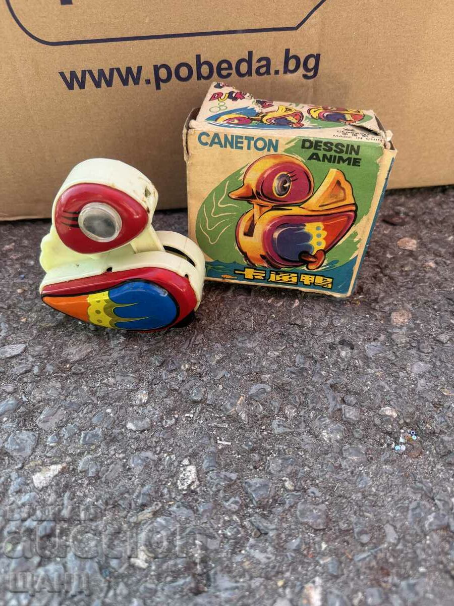 Old mechanical plastic toy duck