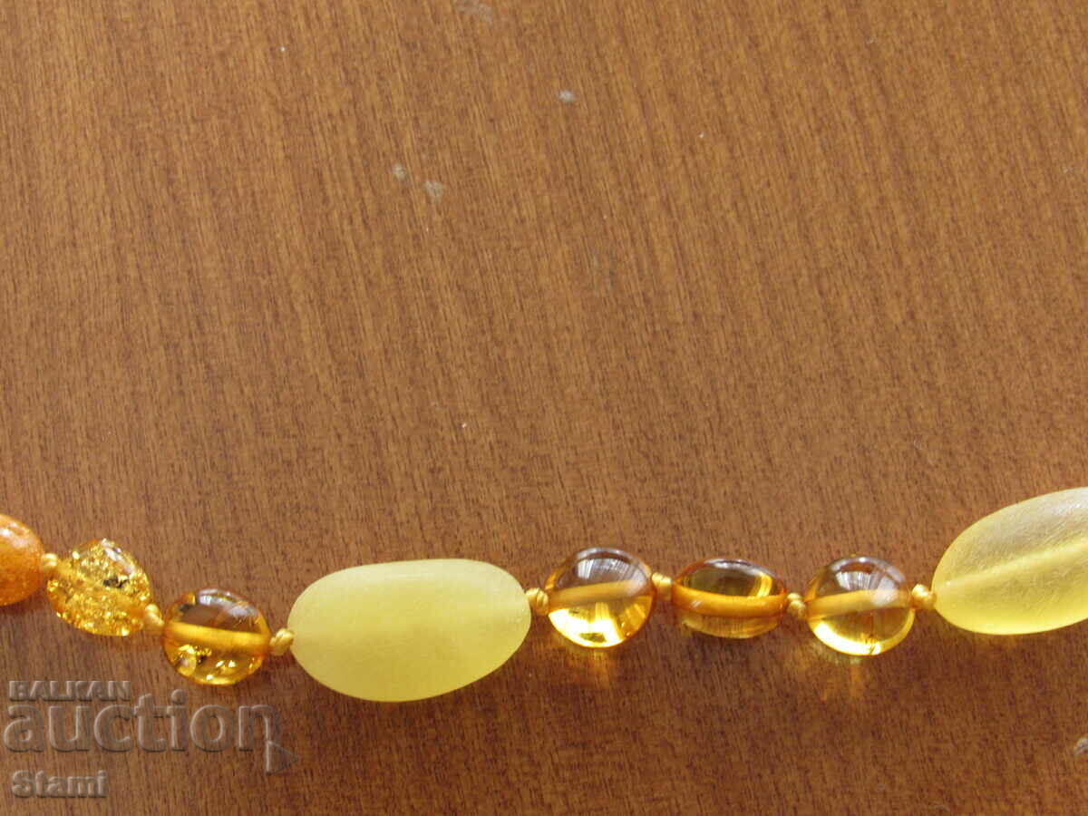Women's circle necklace made of premium Baltic amber with price 76.00 BGN | € 38.86 Women's circle necklace made of premium Baltic amber with price 76.00 BGN | € 38.86
