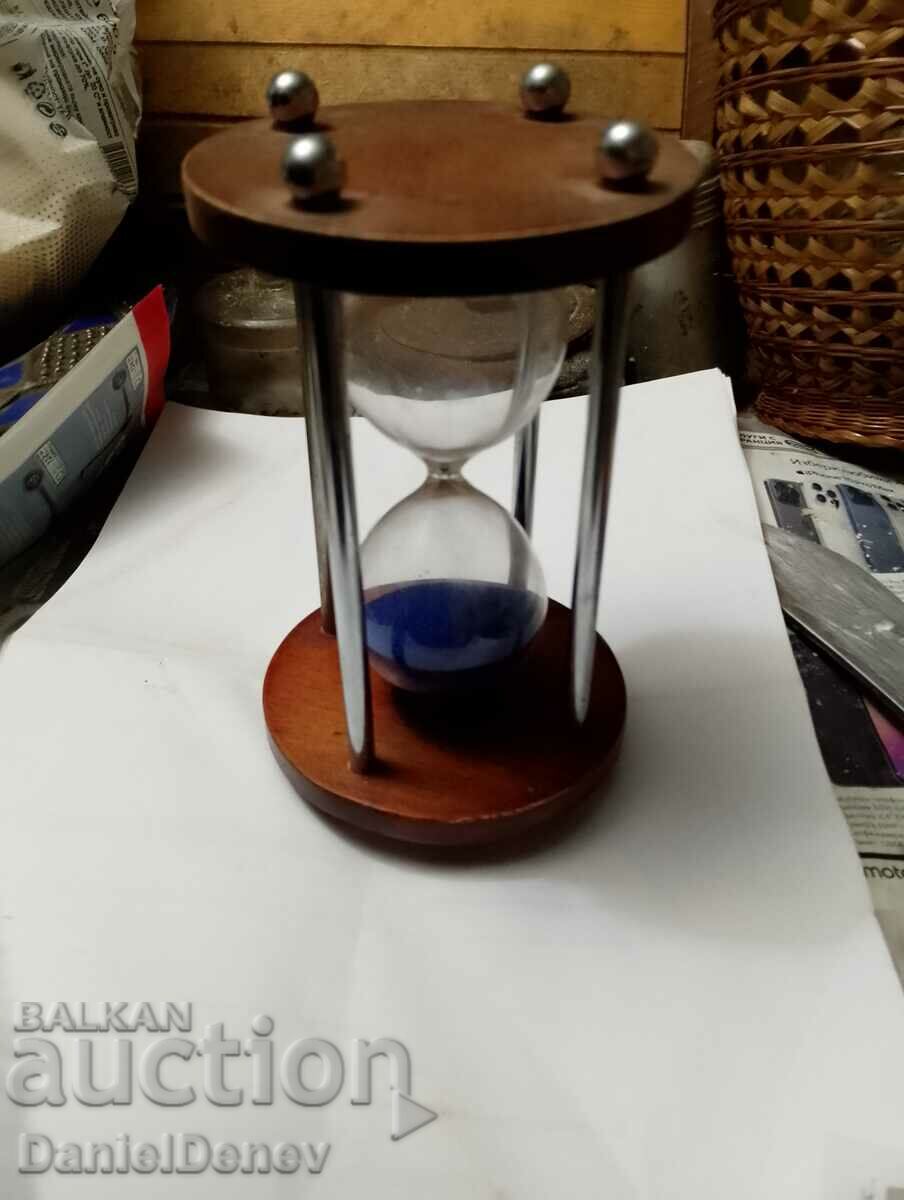 Beautiful hourglass with blue sand