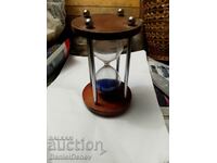 Beautiful hourglass with blue sand