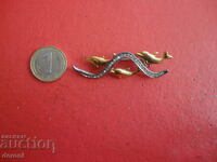 A great gold plated dolphin brooch 38