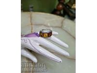 A wonderful antique silver ring with amber