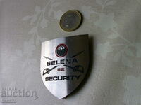 Selena 52 de securitate, emblemă semn de insignă