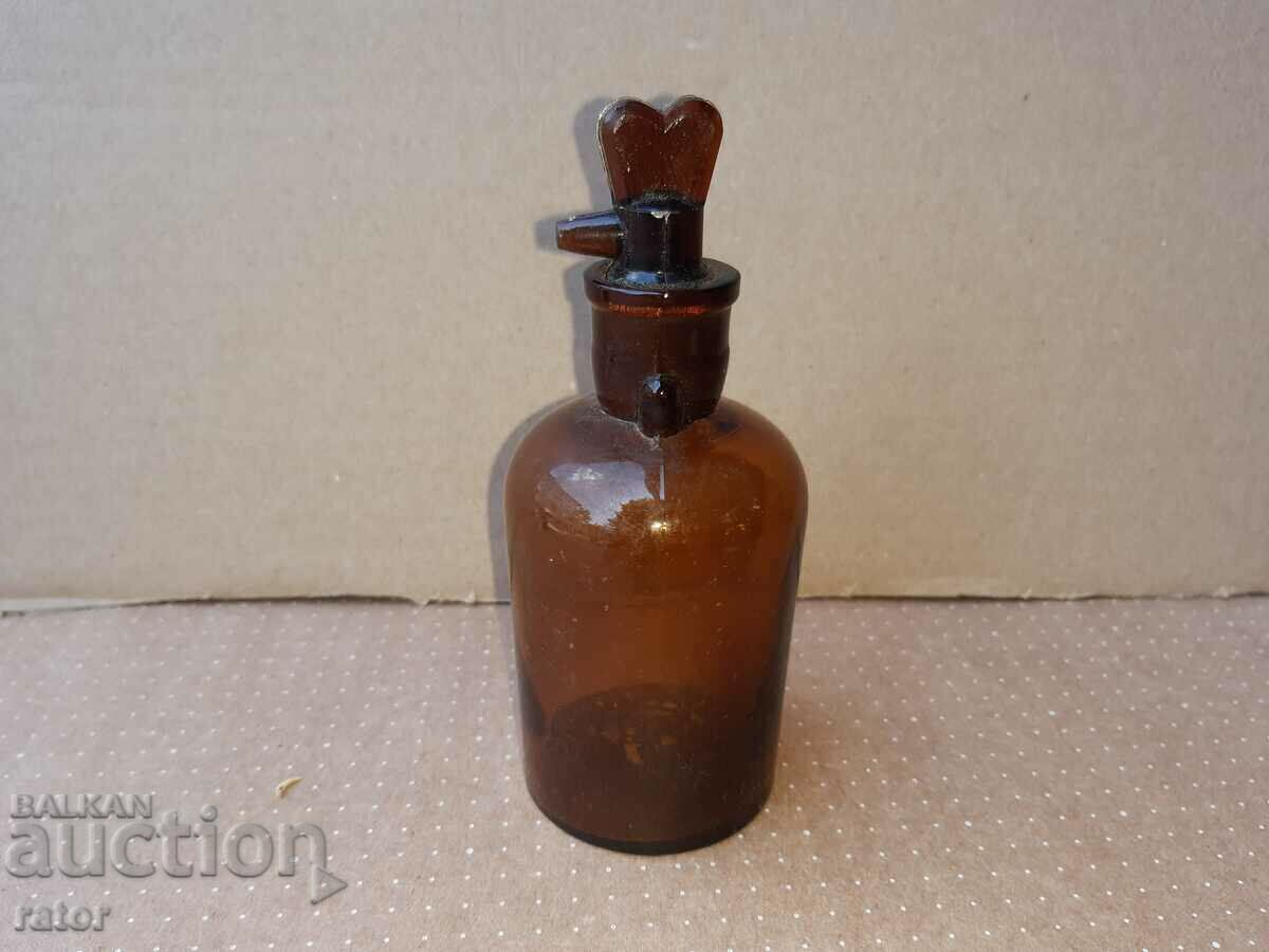 Old apothecary bottle with dropper. Pharmacy glassware