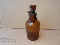 Old apothecary bottle with dropper. Pharmacy glassware